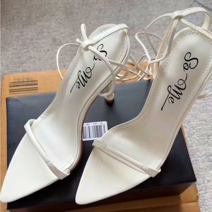 White stiletto tie up heels